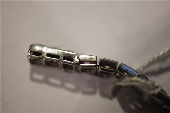 A 1920s/1930s Cartier, platinum, diamond and onyx line bracelet, 7.25in.